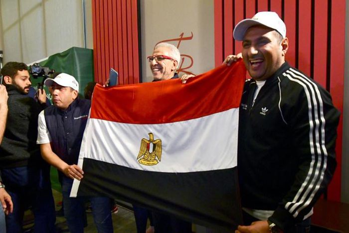 Egyptian representatives celebrate in Dakar after the Confederation of African Football (CAF) executive committee's decision to choose Egypt to host the 2019 Africa Cup of Nations