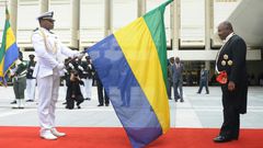 Gabon's president Ali Bongo (R), who took over from his father in 2009, has been absent since October when he suffered a stroke in Saudi Arabia