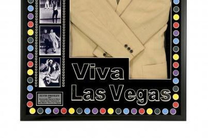 Elvis jacket, gun up for auction at singer's Graceland home