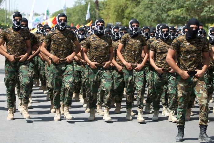 Iraqi members of the powerful Iran-backed Badr Brigades take part in a parade marking al-Quds (Jerusalem) Day in the capital Baghdad, on July 1, 2016