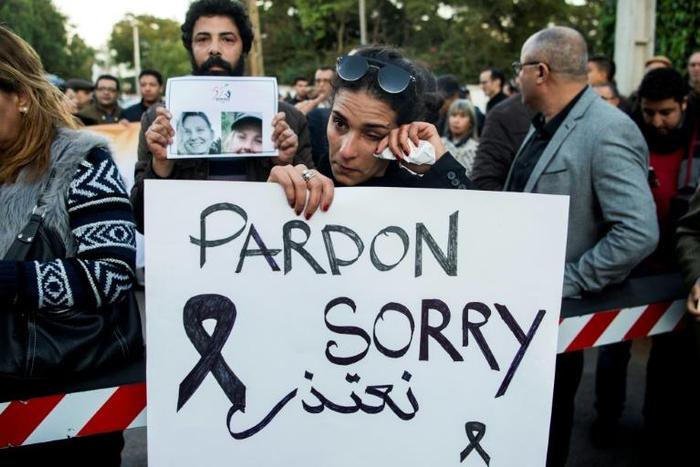 Moroccans attend a vigil for the two murdered Scandinavian women, outside the Danish embassy in Rabat on December 22, 2018