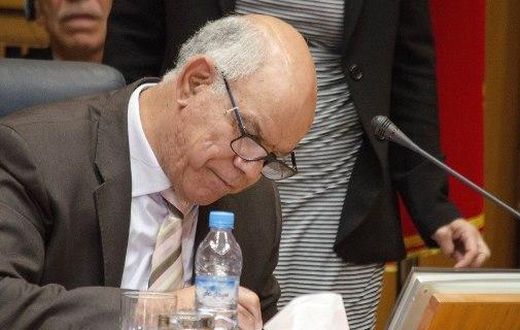 Mohammed Chouaib, head of a delegation from the UN-recognised government, signs a tentative deal