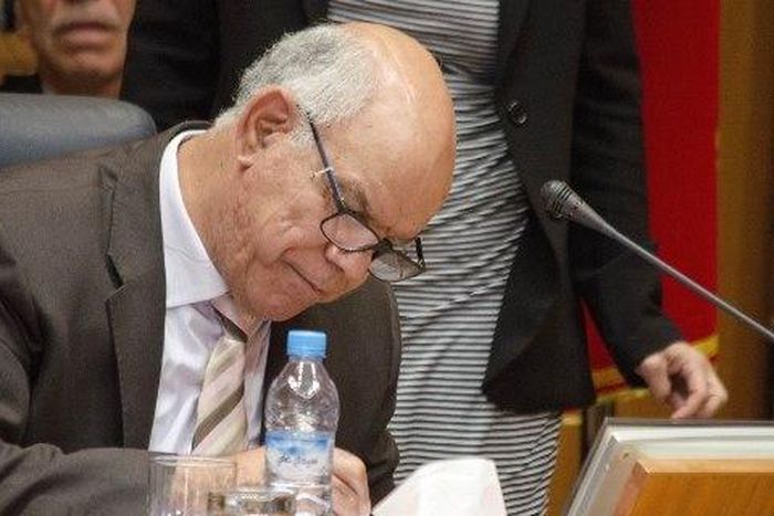 Mohammed Chouaib, head of a delegation from the UN-recognised government, signs a tentative deal