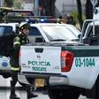 Security forces work at the site of a car bombing at a police cadet training school in Bogota