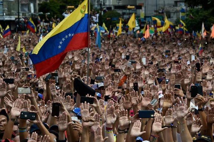 Demonstrators in Caracas rally against Nicolas Maduro, who the United States has declared to be illegimate as the president of Venezuela