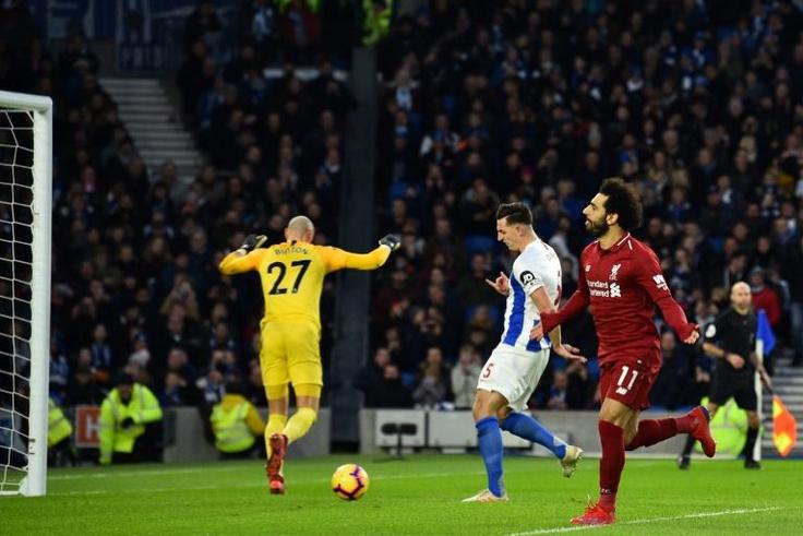 Mohamed Salah celebrates after scoring from the decisive penalty in Liverpool's 1-0 win away to Brighton on Saturday