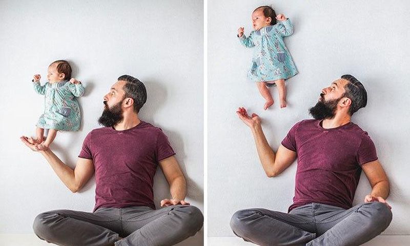 Dad plays with new born baby in candid photos