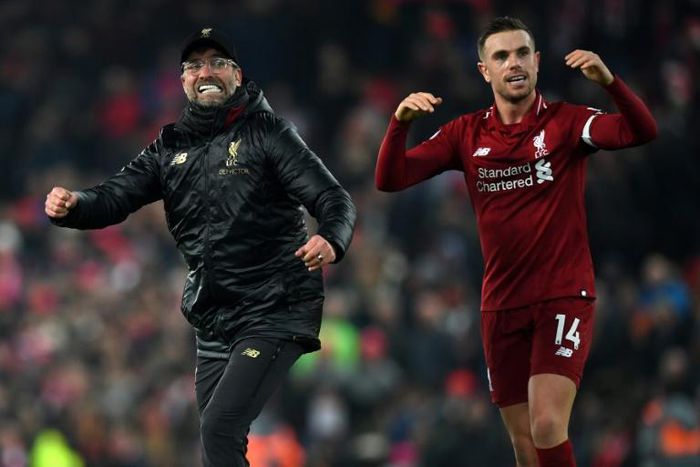 Liverpool manager Jurgen Klopp (left) and captain Jordan Henderson (right) celebrate a thrilling 4-3 win over Crystal Palace
