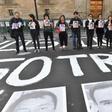 Members of the press hold images of colleagues during a protest against the murder or disappearance of journalists and photojournalists in Mexico, in front of the National Palace in Mexico City on June 1, 2018