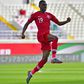 Qatar's Almoez Ali celebrates one of his four goals aagainst North Korea at a near-empty stadium