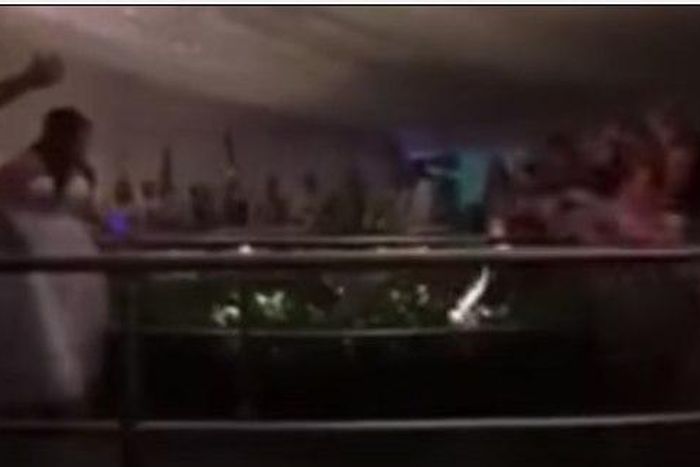 The flowers had ended up in a pit in front of the ladies, but one determined woman wanted the bouquet by all means