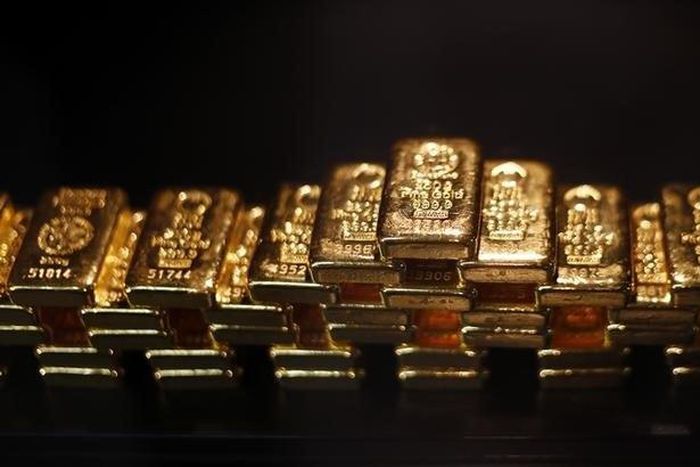 Gold bars are stacked at a safe deposit room of the ProAurum gold house in Munich March 6, 2014. REUTERS/Michael Dalder