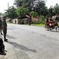 Members of Muslim rebel group Moro Islamic Liberation Front stand guard in the town of Sultan Kudarat ahead of the surrender of combatants with their firearms to President Benigno Aquino III