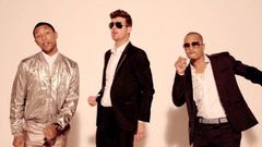 Pharell Williams, Robin Thicke and T.I as shown in 'Blurred Lines' video