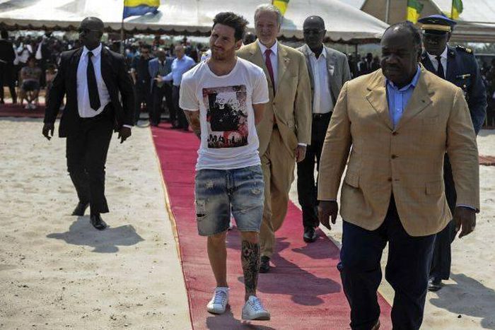 Lionel Messi meets Gabon president Ali Bongo Ondimba (right)