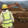 Employees stand in an open pit at Banro's Twangiza mine in eastern Congo, September 28, 2011.   REUTERS/Tom Kirkwood