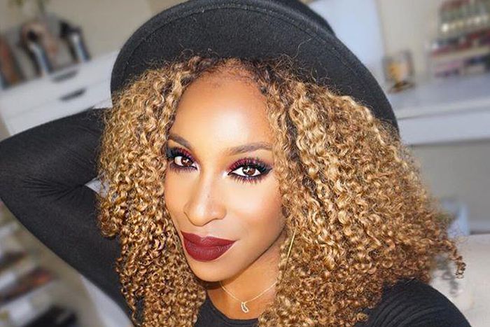 Jackie Aina rocks red smokey eye look