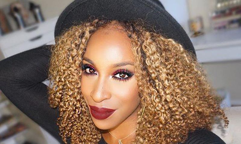 Jackie Aina rocks red smokey eye look