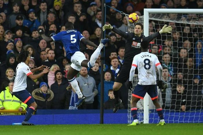 Kurt Zouma (2L) heads in the opening goal of Everton's 2-0 win over Bournemouth in the Premier League at Goodison Park on Sunday