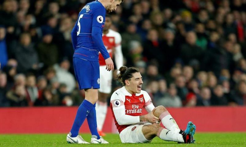 Arsenal defender Hector Bellerin reacts after picking up a knee injury against Chelsea
