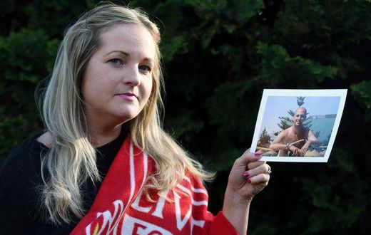 Caroline Waine of Woolton. Caroline had to withdraw from the Echo Win a Wedding Competition after the death of her fiancé, Stuart Murphy, from cancer. Pictured here with his Liverpool FC blanket and photograph