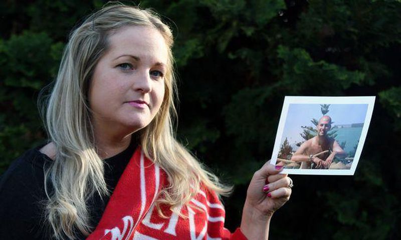 Caroline Waine of Woolton. Caroline had to withdraw from the Echo Win a Wedding Competition after the death of her fiancé, Stuart Murphy, from cancer. Pictured here with his Liverpool FC blanket and photograph