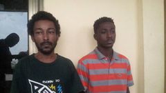 The suspects, Sam Akai (L) and Philip Larbi