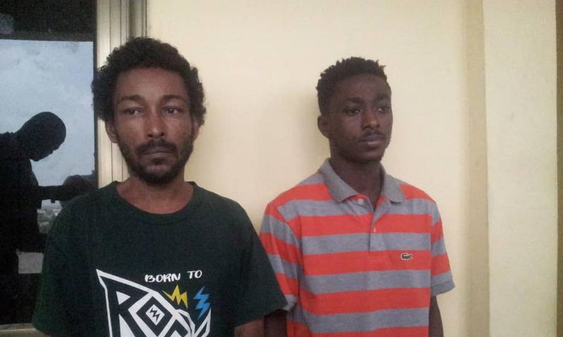 The suspects, Sam Akai (L) and Philip Larbi