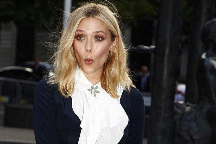 Elizabeth Olsen makes a funny face when she realized she was about to have a Marilyn Monroe moment