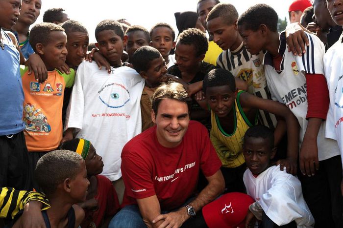 Roger Federer in South Africa with children supported by his Roger Federer Foundation