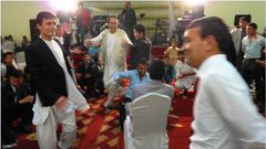 Afghan weddings, such as this one in Kabul, often take place in lavish halls. A law passed in March aims to rein in what is traditionally a very costly celebration.