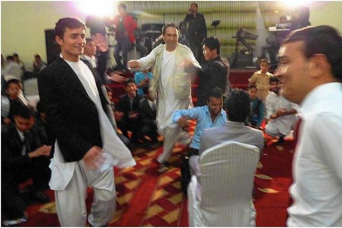 Afghan weddings, such as this one in Kabul, often take place in lavish halls. A law passed in March aims to rein in what is traditionally a very costly celebration.