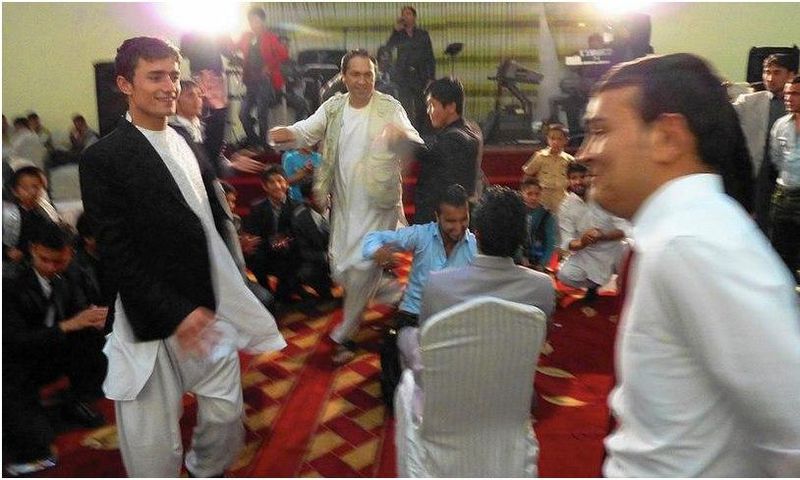 Afghan weddings, such as this one in Kabul, often take place in lavish halls. A law passed in March aims to rein in what is traditionally a very costly celebration.
