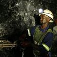 Mine workers is seend underground in Modderfontein east mine, outside Johannesburg, February 3, 2009.  South Africa's junior miner Aflease Gold said on Tuesday it aims to produce 500,000 ounces of the precious metal per year in five years based on the ...