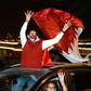 Qatari fans celebrate after their national team's victory over UAE to reach the Asian Cup final