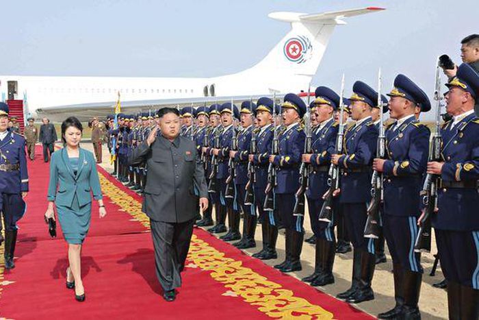 North Korean leader Kim Jung-Un, with wife Ri Sol-Ju inspecting a guard of honor. Jung-Un is the youngest dictator in the world.