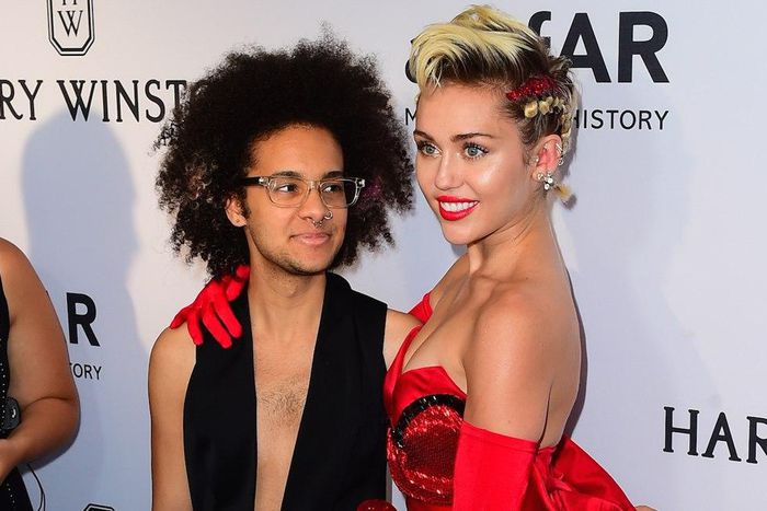 Tyler Ford and Miley Cyrus at the amfAR Inspiration Gala