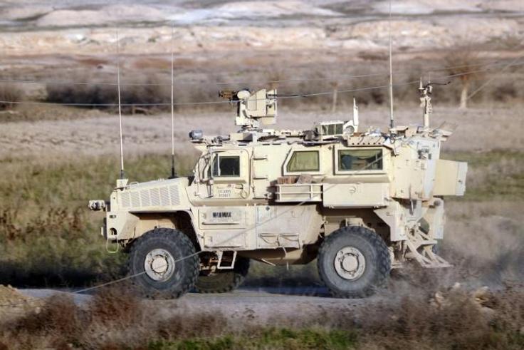 A US military vehicle drives through the Syrian village of Baghouz in eastern Deir Ezzor province on January 26, 2019