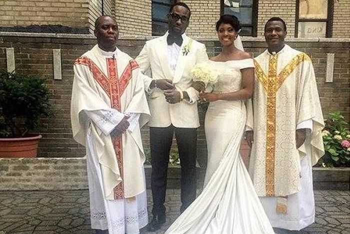 Mr and Mrs Ajibade with the priests