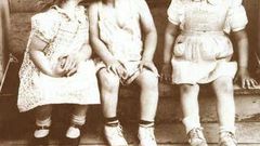 Three children act out jealous scene