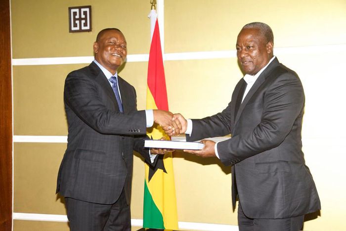 (File photo) Justice Senyo Dzamefe presenting the report to President John Mahama