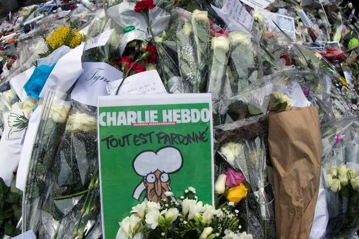 A makeshift tribute outside the Paris offices of the Charlie Hebdo satirical magazine, where 12 people were killed in 2015 in an attack that marked the start of a wave of jihadist attacks in France