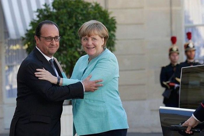 Socialist French president, Francois Hollande welcomes German Chancellor Angela Merkel