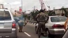 Soldier caught punishing a driver