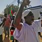 Sudanese men shout slogans during an anti-government protest following Friday noon prayers on January 18, 2019 outside a mosque in Omdurman