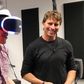 TechCrunch's Kyle Russell reviewing PlayStation's VR headset with PlayStation director Richard Marks.