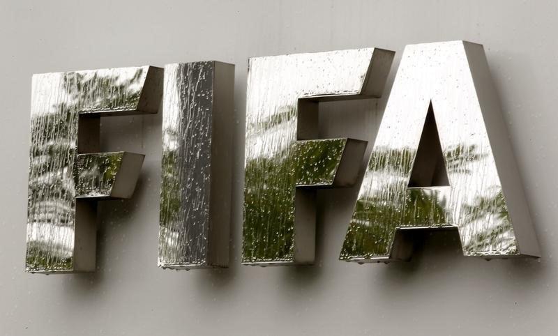 Water flows over the FIFA logo in front of the FIFA headquarters during heavy rainfall in Zurich July 22, 2011. REUTERS/Arnd Wiegmann