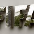 Water flows over the FIFA logo in front of the FIFA headquarters during heavy rainfall in Zurich July 22, 2011. REUTERS/Arnd Wiegmann