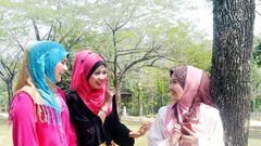 ___3960337___https:______static.pulse.com.gh___webservice___escenic___binary___3960337___2015___7___10___15___5665171-young-muslim-girl-chatting-at-park