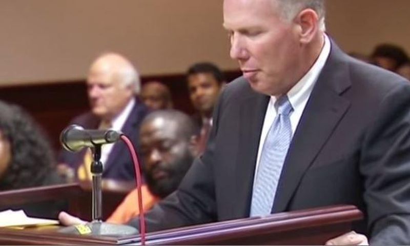 Rick Ross seated in the court while his attorney spoke on the bail bond